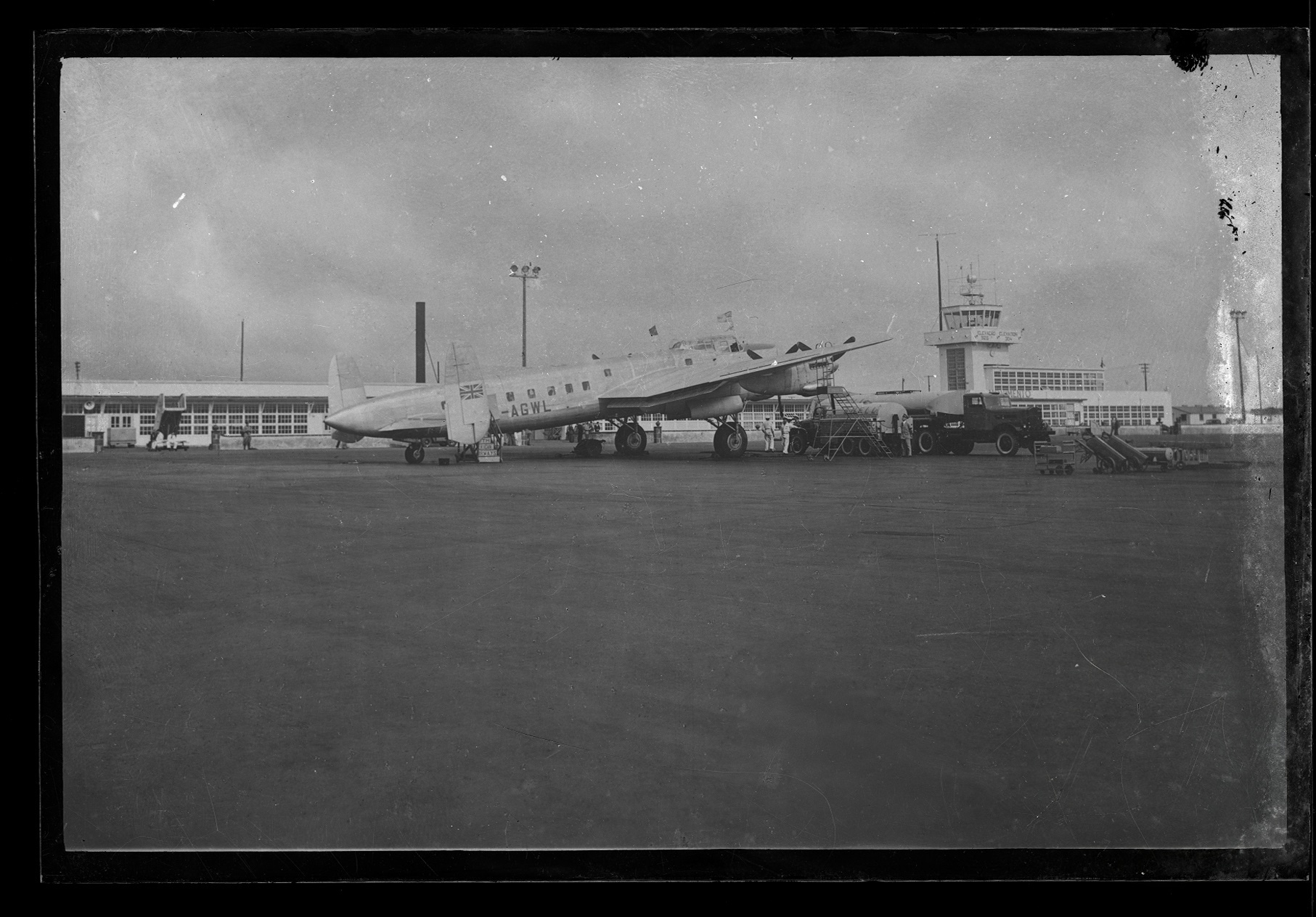 The Santa Maria Airport apron, circa 1945–1949: British South American Airways Avro York G-AGWL "Star Guide" refuelling in front of the terminal and control tower. The event of 21 September 1954 took place on this same apron, the tower and terminal building still in the same configuration; Monteiro's guard post stood near the road junction just out of frame to the right.