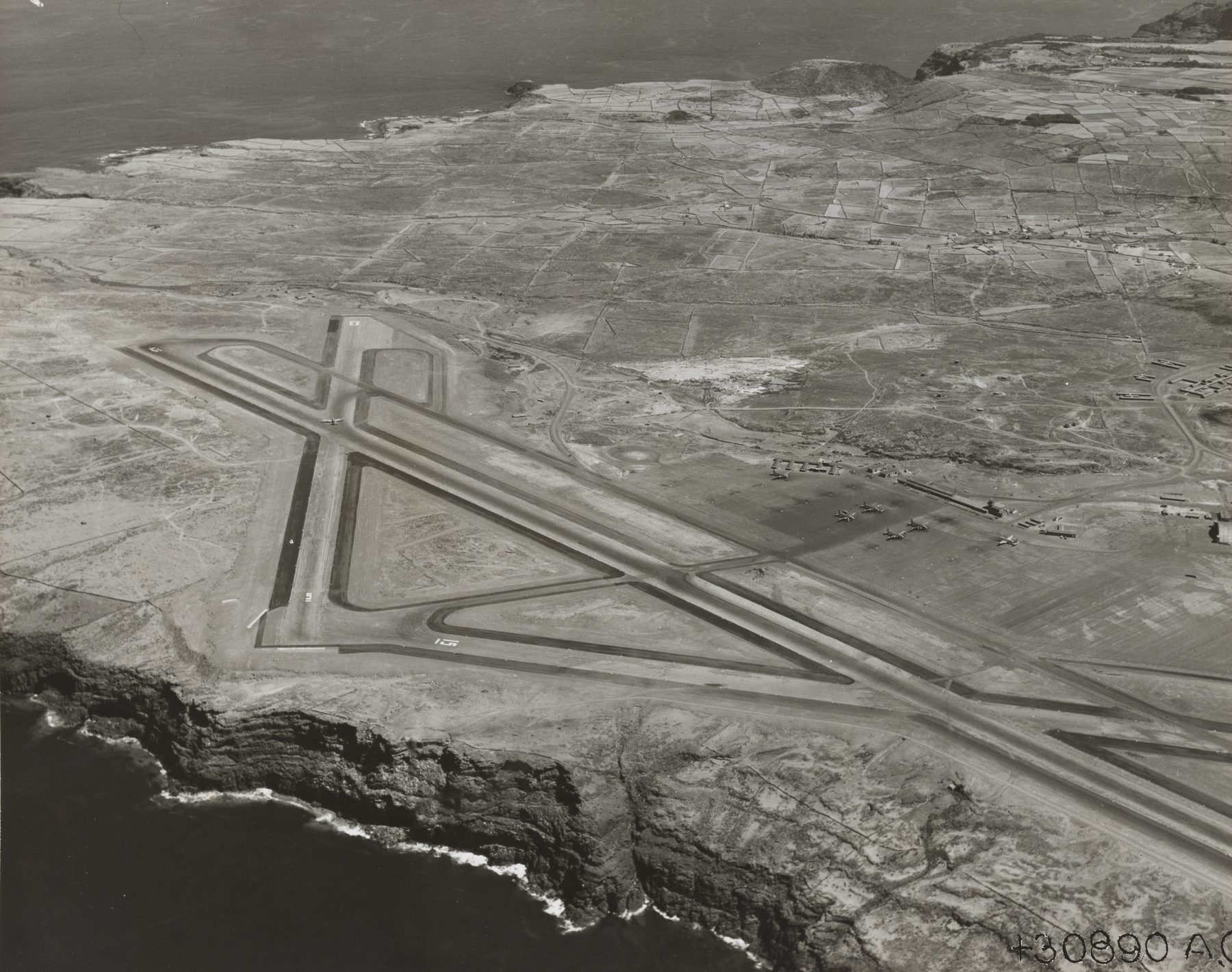 Santa Maria airfield on its volcanic plateau, from a 1940s U.S. Army Air Forces "Landing Fields — Azores" survey. Runway 18/36 runs north-south along the cliff-edged south-east corner of the island; the terminal, control tower, and apron where Monteiro was stationed sit at the north-west end, connected to Vila do Porto (lower left, out of frame) by the single airport road.